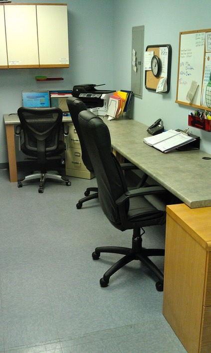 OT in Motion office area showing desks.