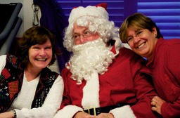 OT in Motion owners Jan Halley and Janet Correia with Santa Claus.